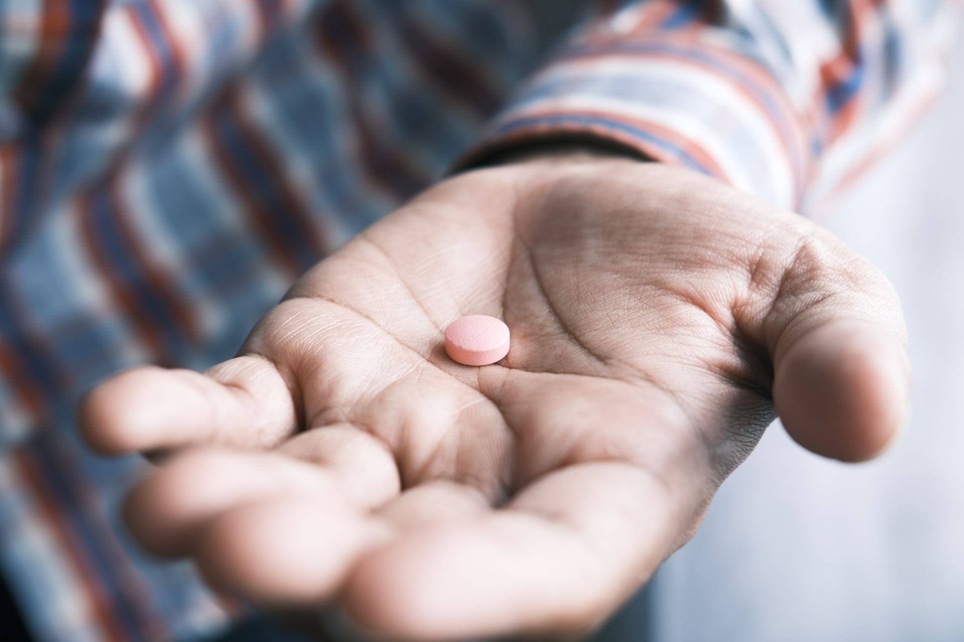 medication in a persons hand